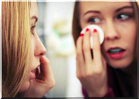 young woman removing makeup