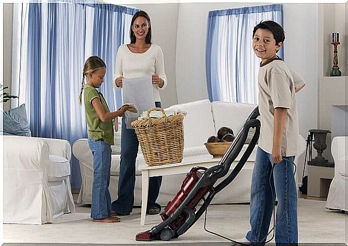 family cleaning the house together