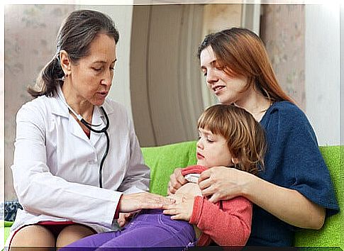 Doctor examining the presence of intestinal parasites in a child