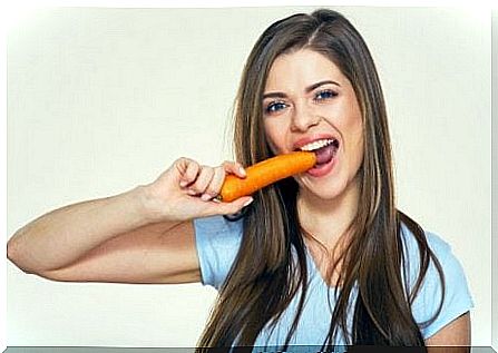 woman eating carrot