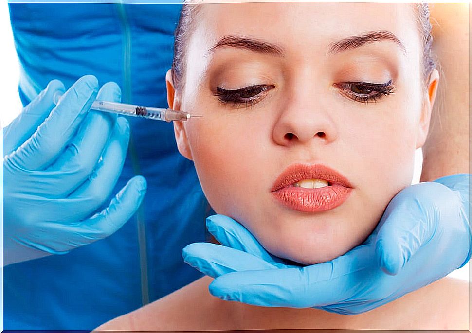 Woman applying botulinum toxin