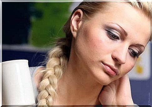 Woman thinking about symptoms of intestinal polyps