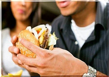 man eating fast food