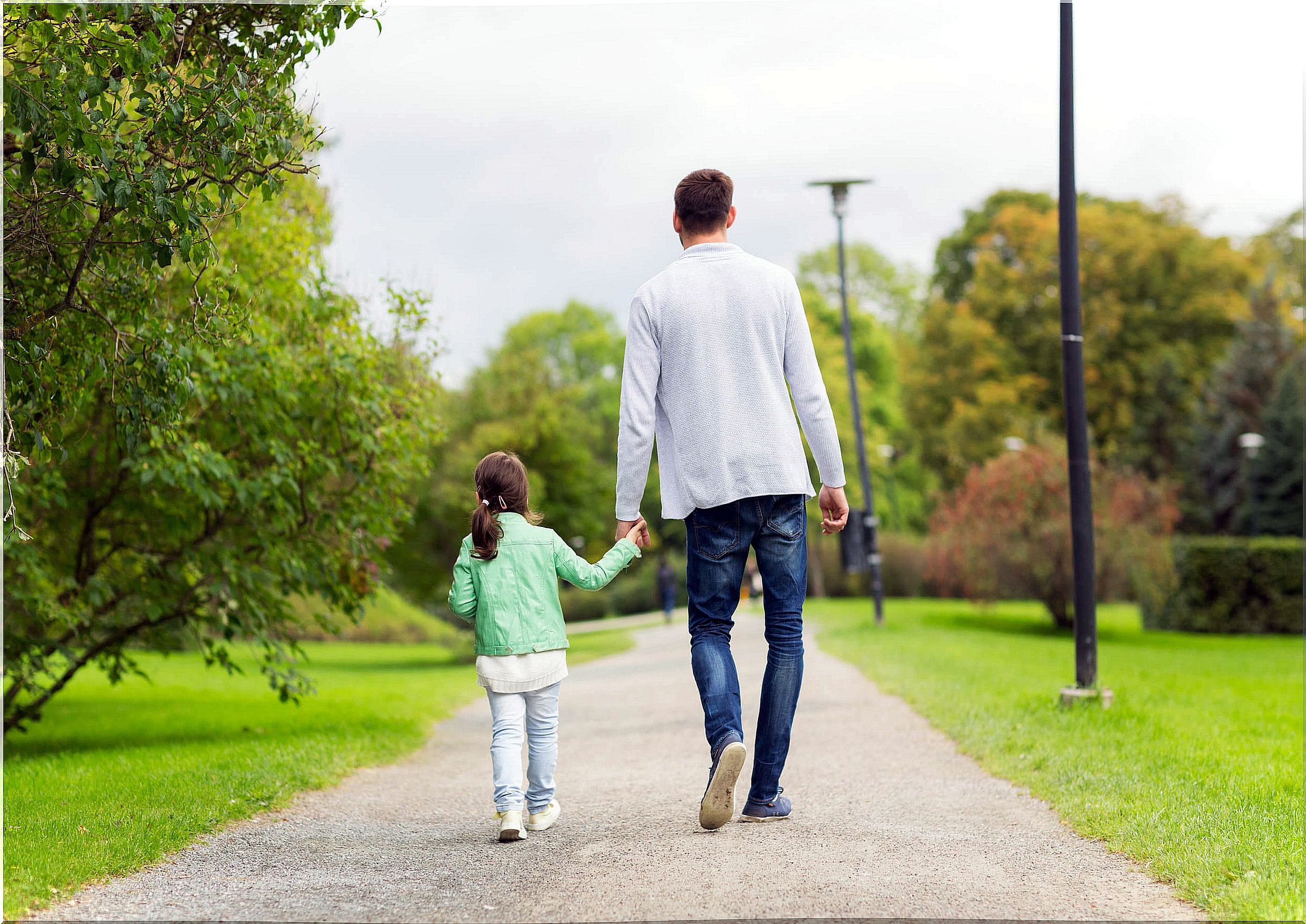 father and daughter walking